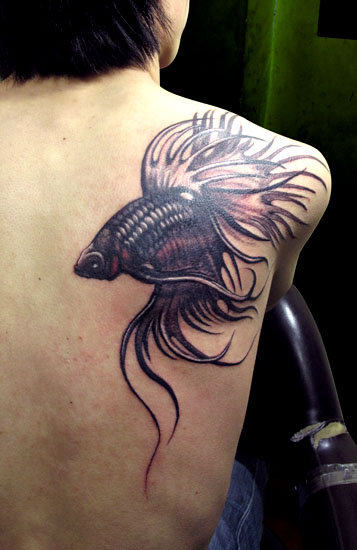 cool fish tattoo on the back